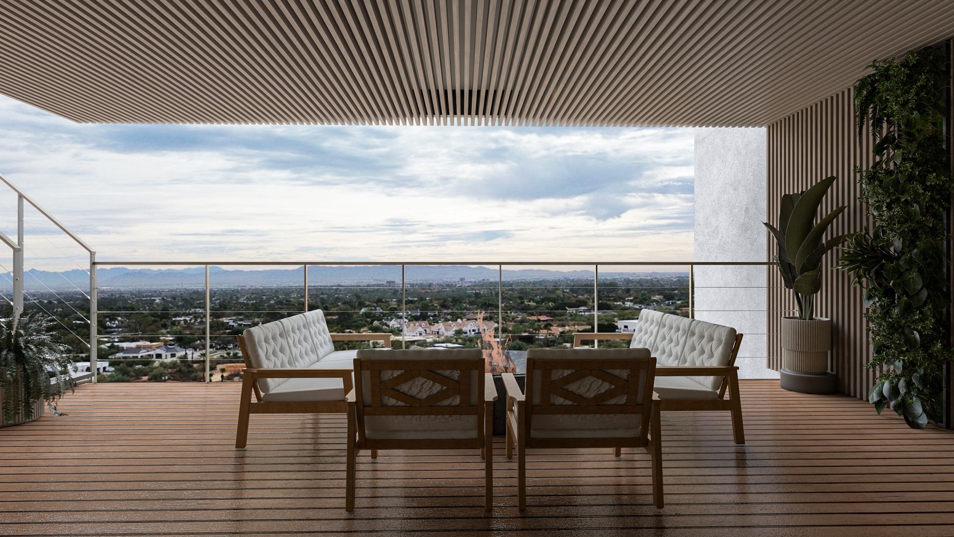 A balcony with a table and chairs and a view of the city.