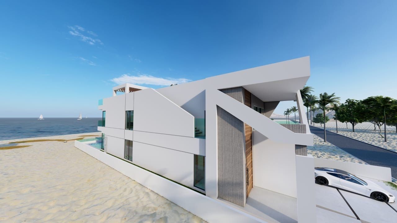 A white car is parked in front of a white building on the beach.