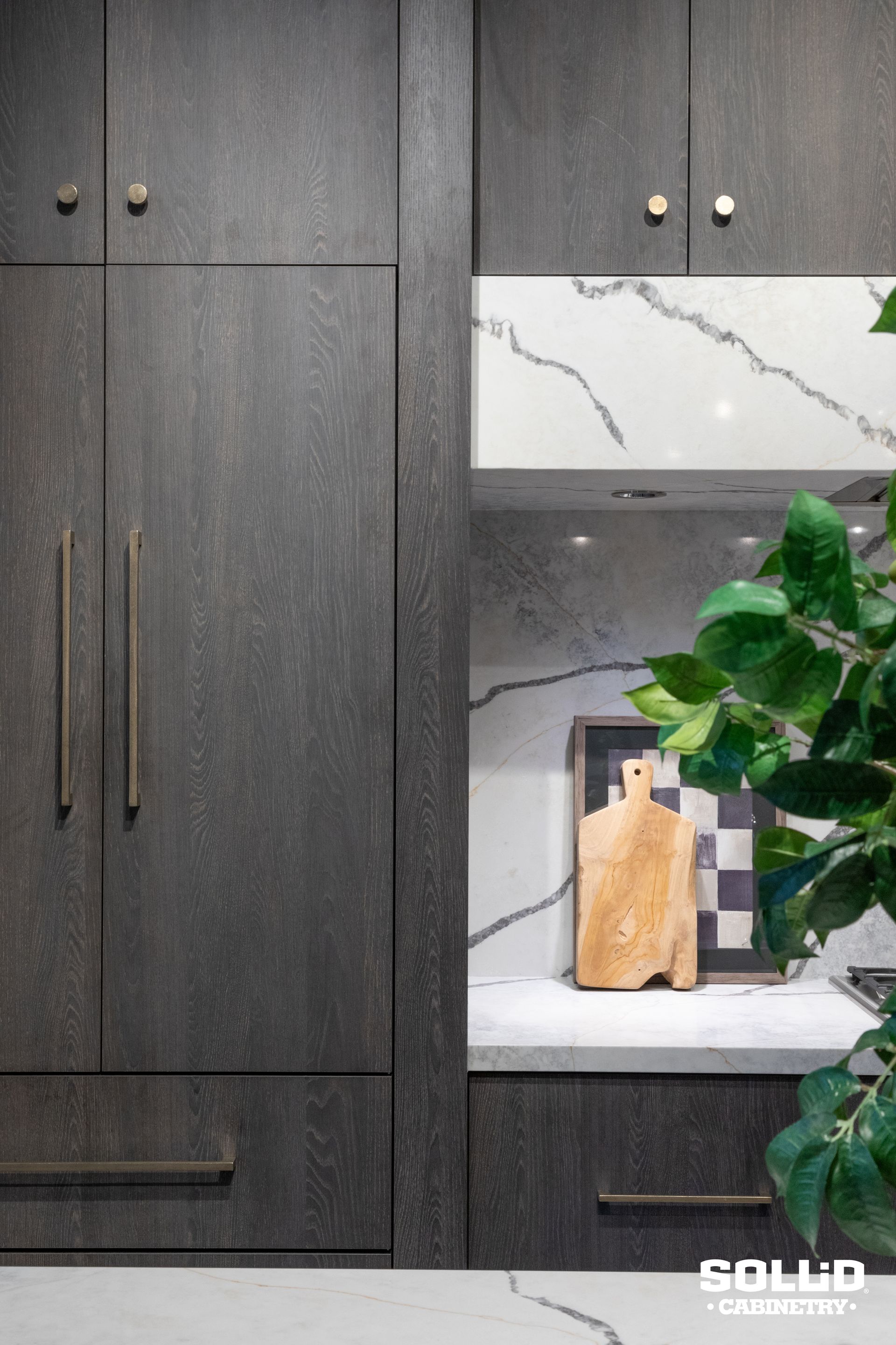 There is a cutting board on the counter in the kitchen.