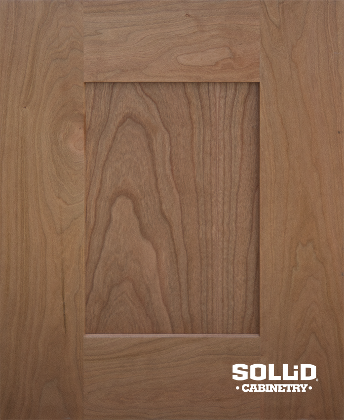 A solid cabinetry door is shown in a close up