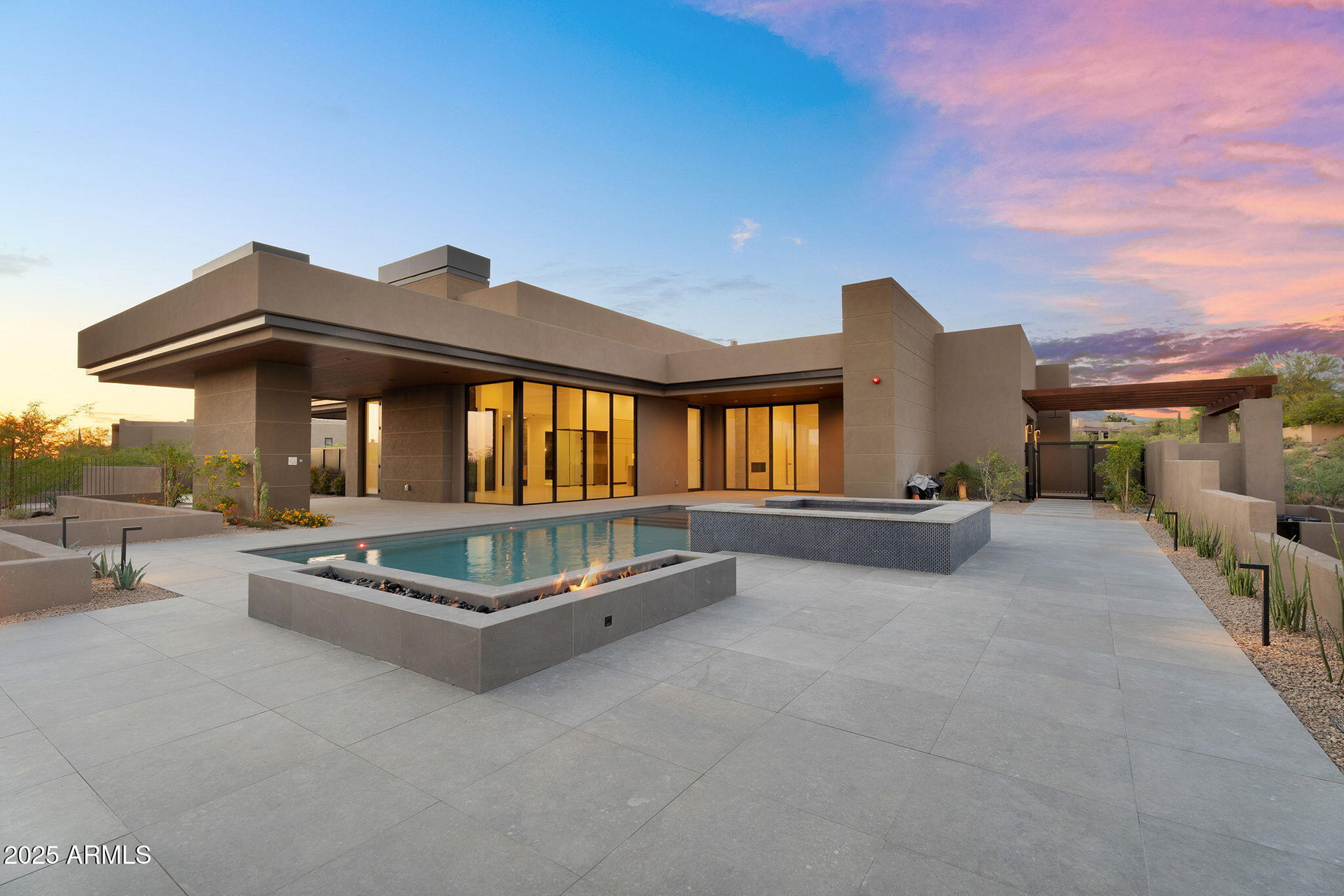A large house with a swimming pool in front of it.