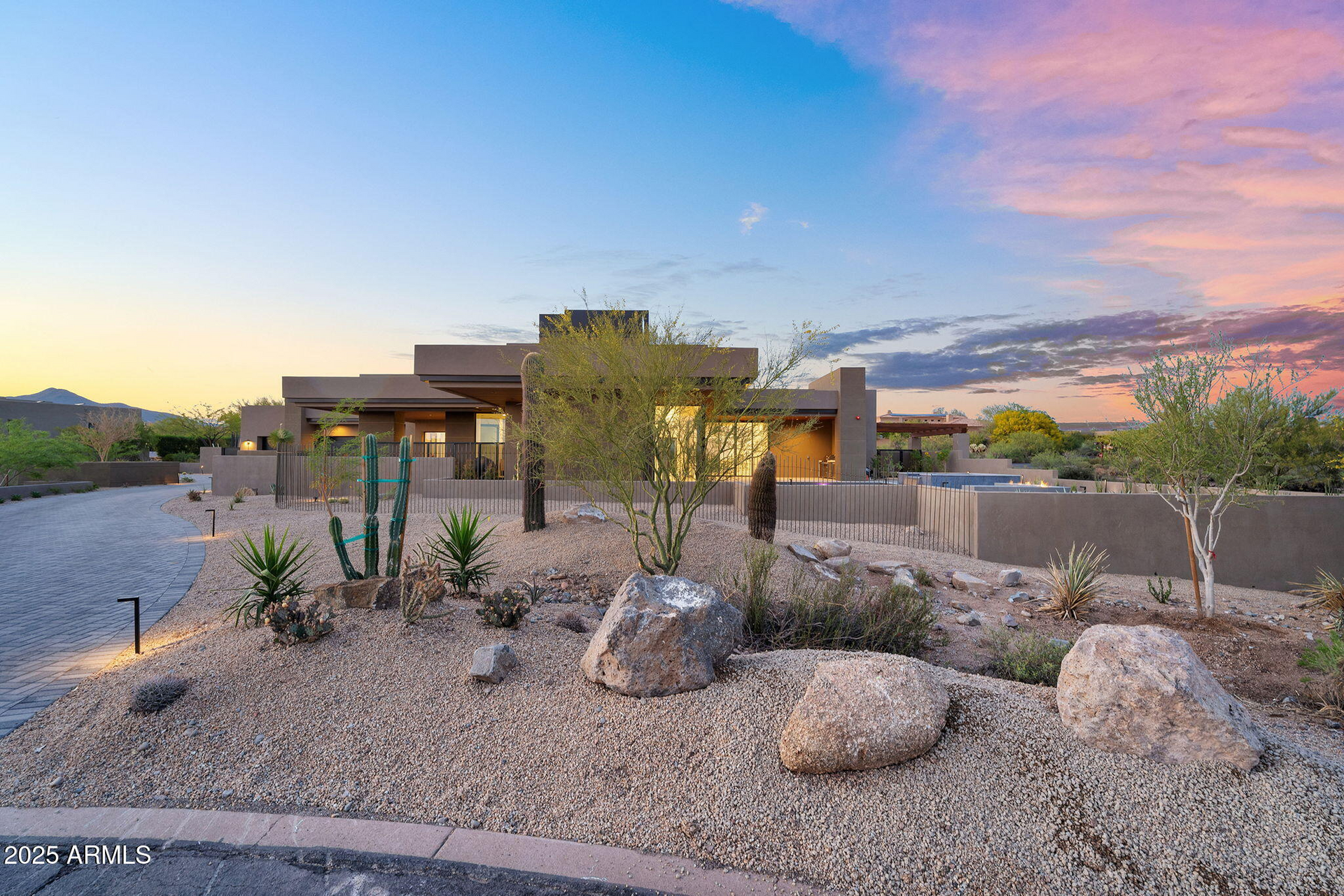 A large house with a lot of rocks in front of it.