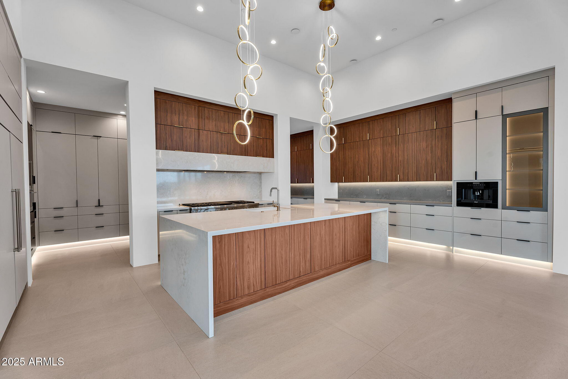 There is a large island in the middle of the kitchen.