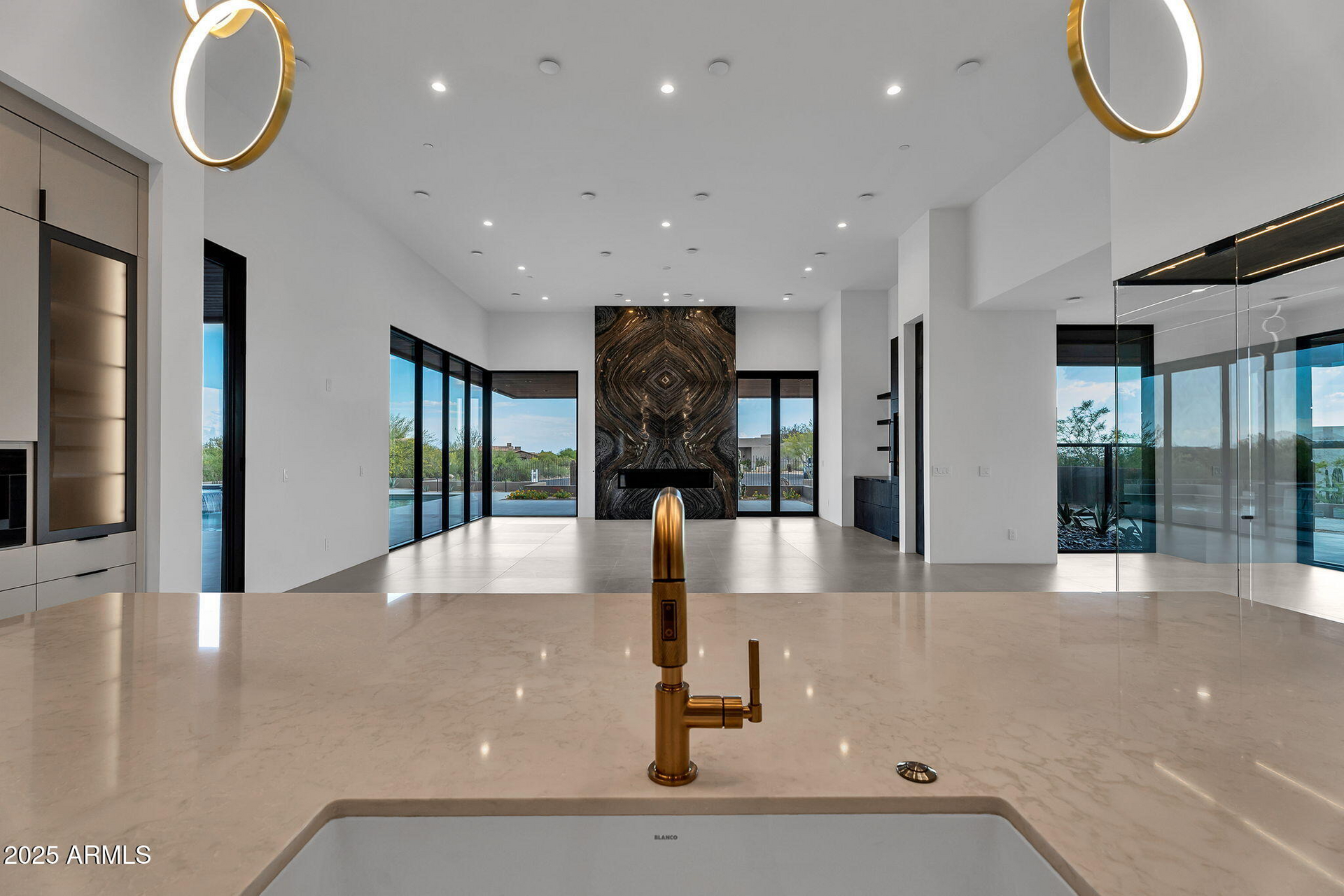 A kitchen with a sink and a faucet in it