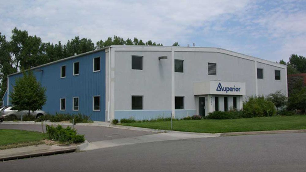 A blue and white building with the word superior on it