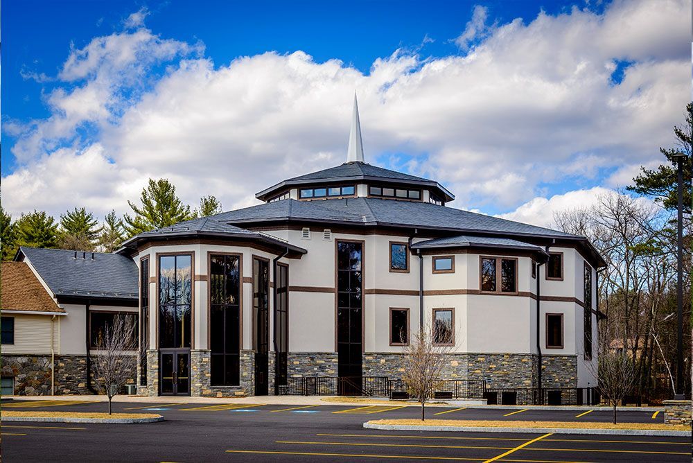A large building with a steeple on top of it