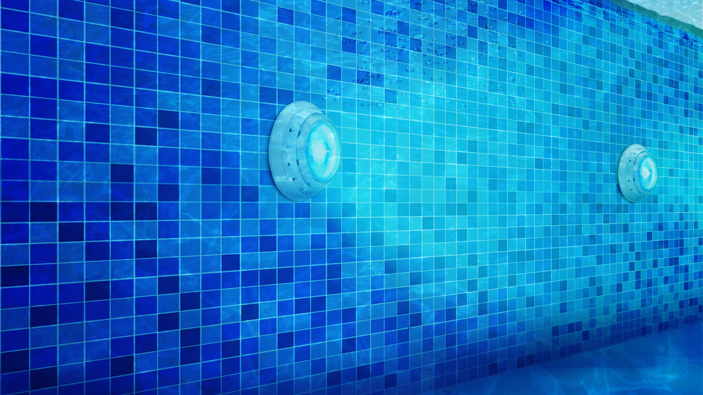 Blue tiled swimming pool wall with underwater lights