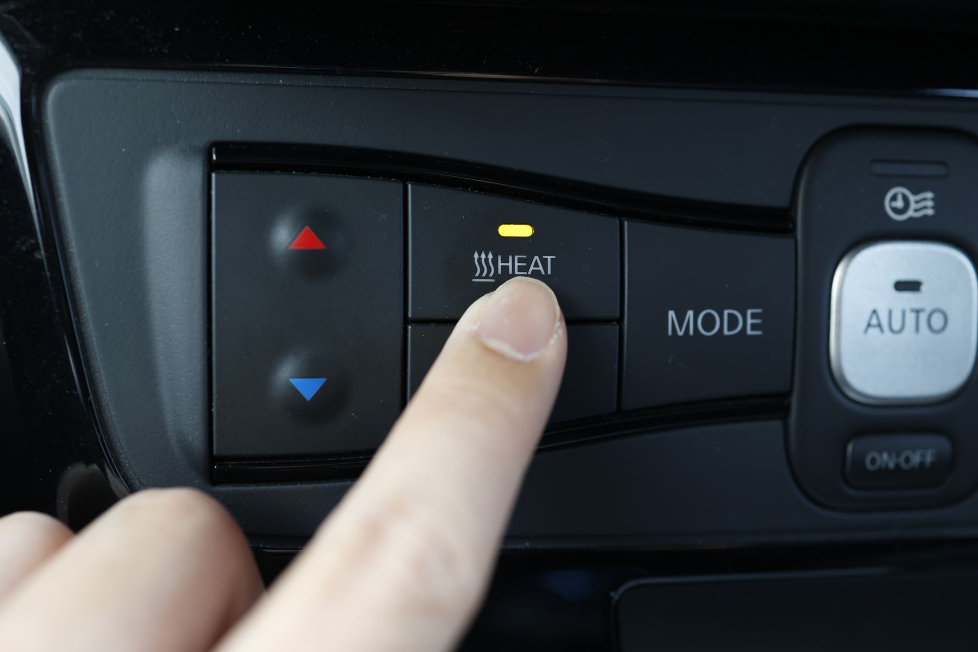 Finger presses a car's 