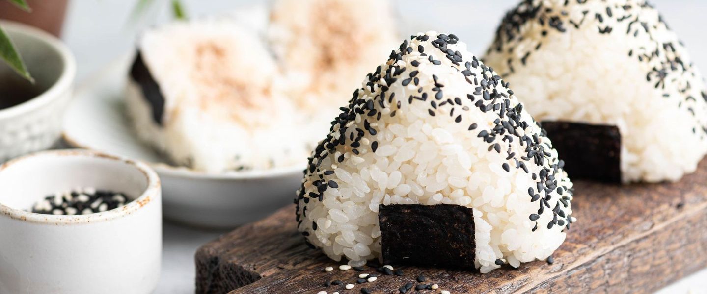 handcrafted omusubi (rice ball) with sesame and seaweed