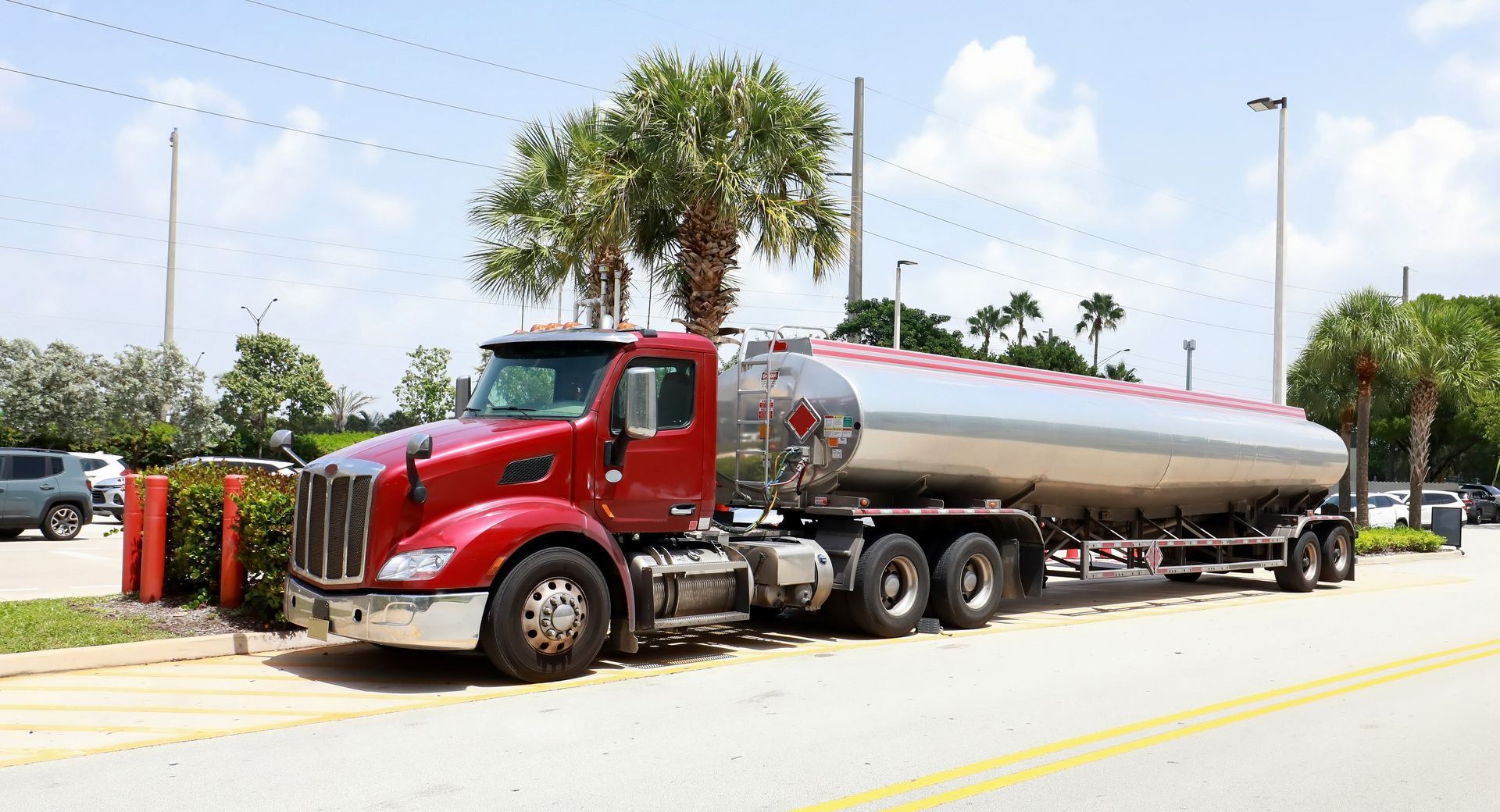 Fuel truck delivering gas at a local gas station. Fuel truck delivering gas at a local gas station.