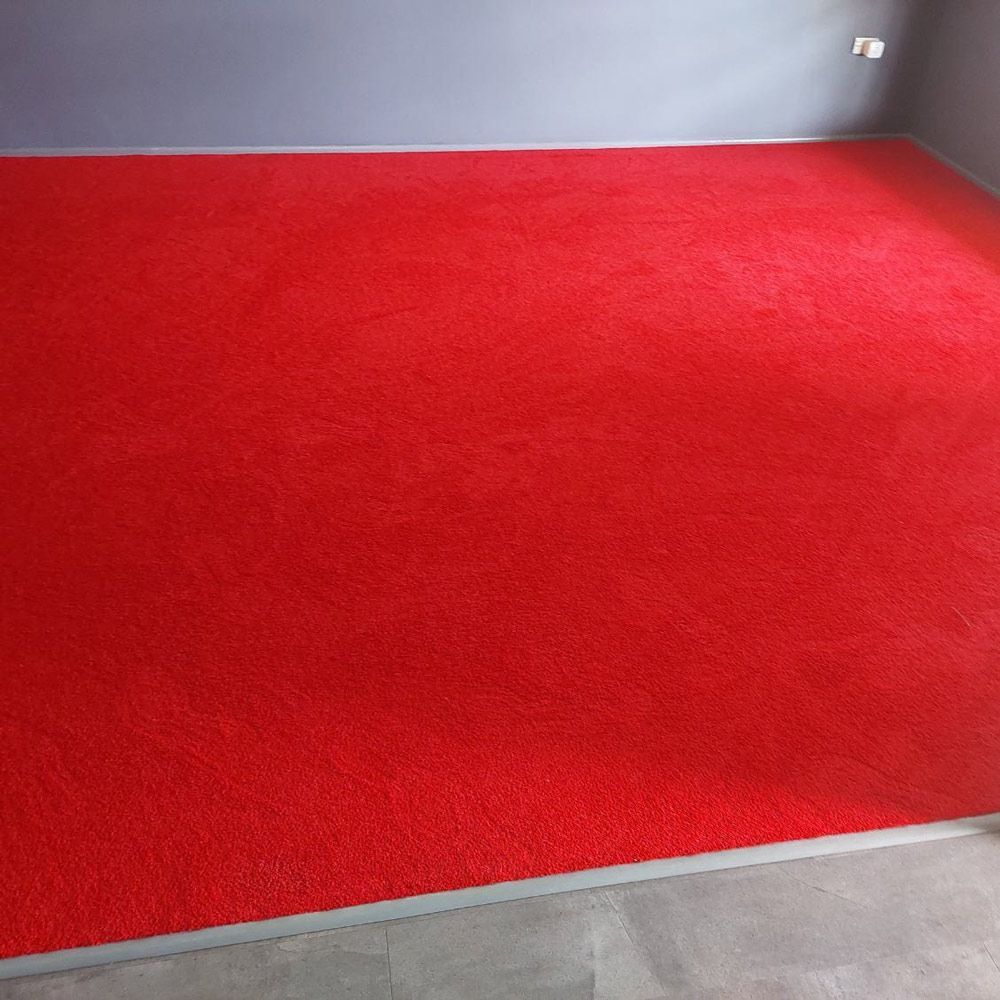 Installed Red Carpet in An Empty Room