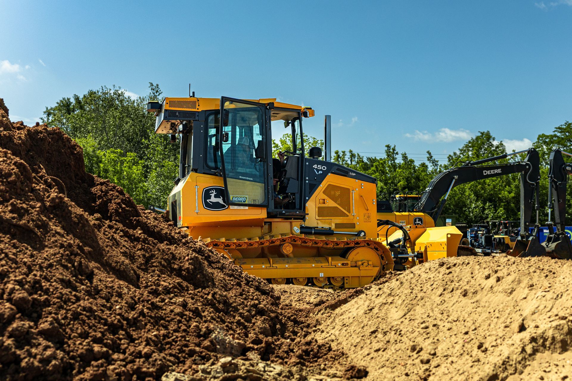 A John Deere machine equipped with SmartGrade™ technology