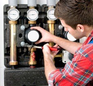 Technician Servicing Heating Boiler — Heating Services in East Providence, RI