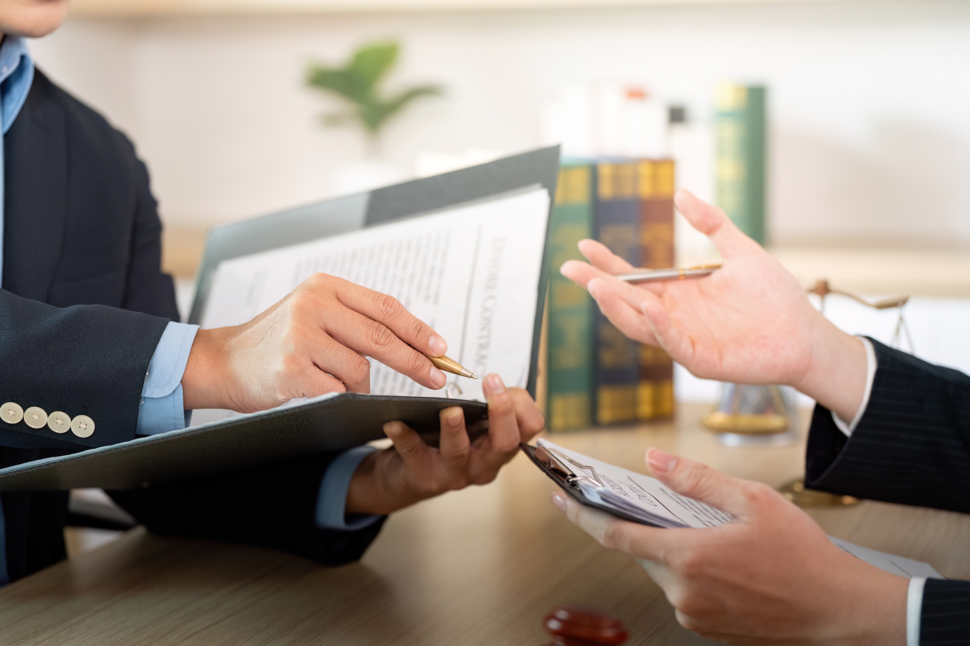Red car with severe damage to the rear, loaded on a tow truck.