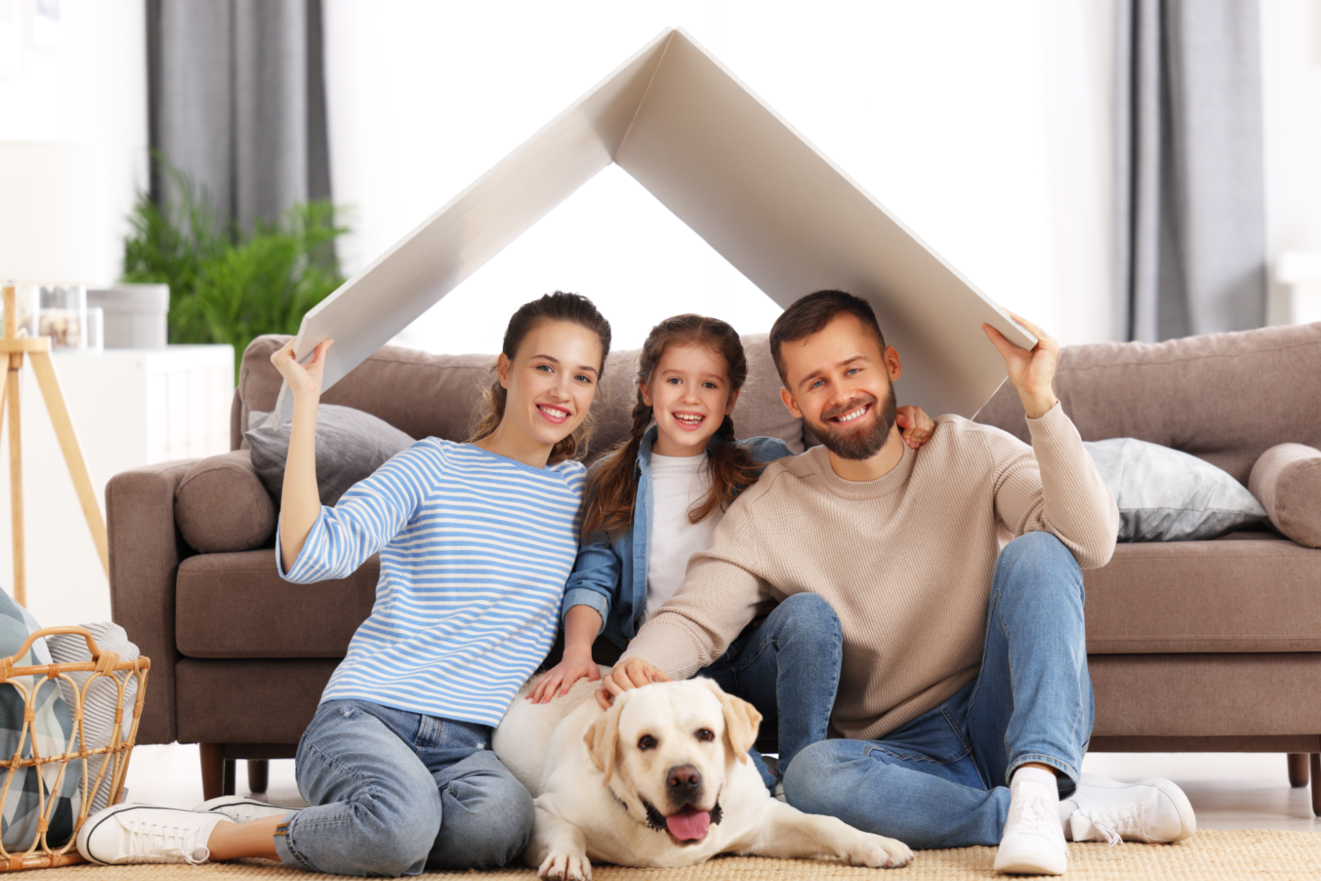 Red car with severe damage to the rear, loaded on a tow truck.