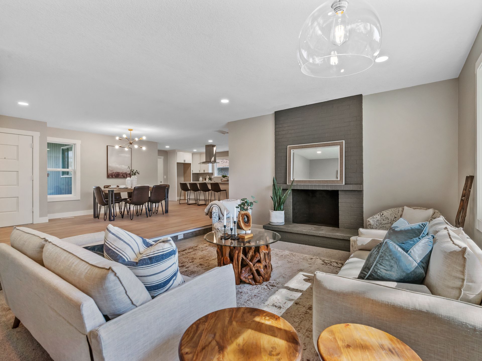 A living room filled with furniture and a fireplace.