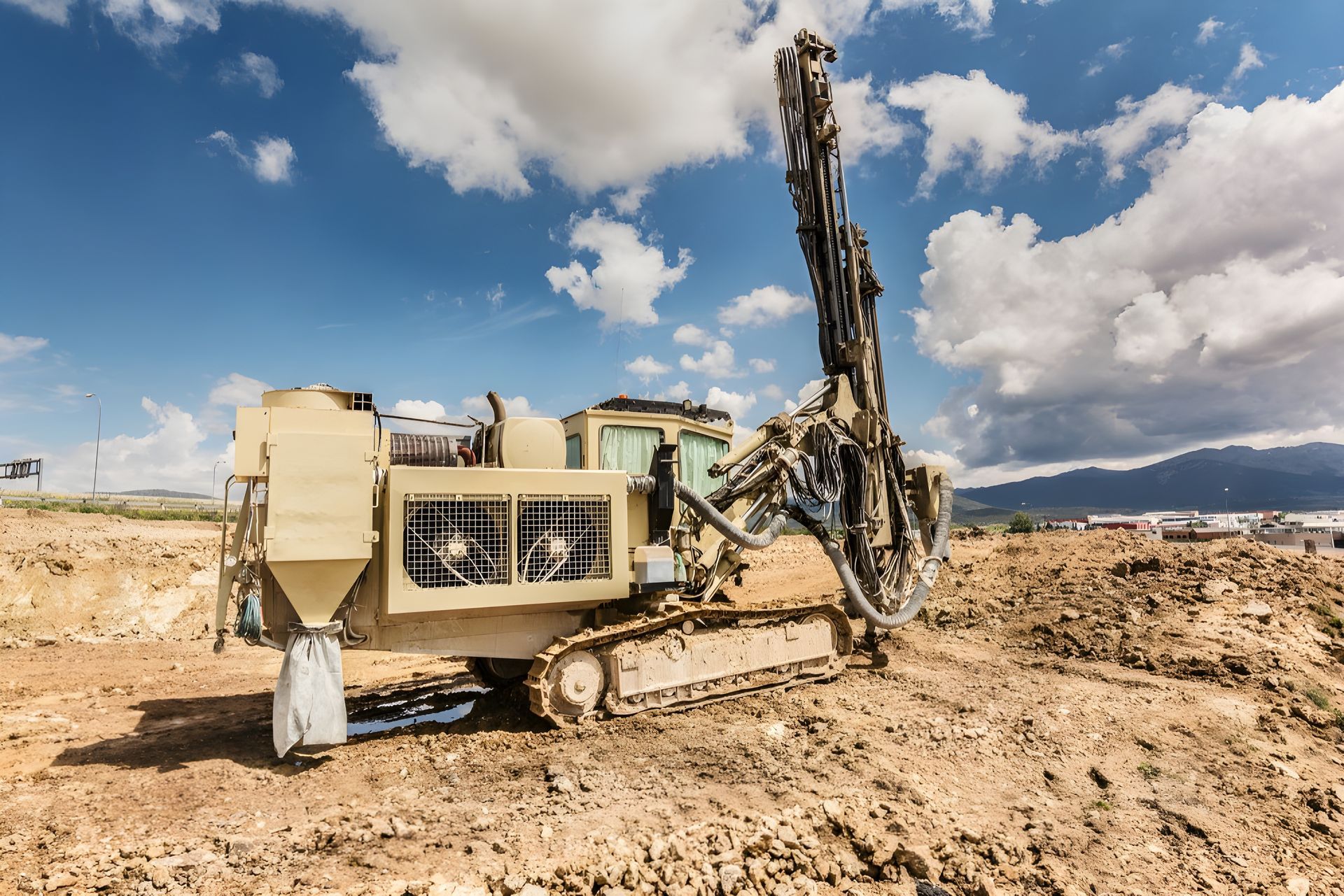 A Large Machine is Sitting in the Middle of a Dirt Field — Hothams In Dubbo, NSW