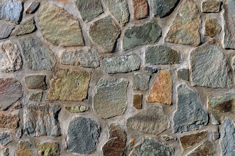A Close Up of a Stone Wall Made of Different Types of Rocks — Hothams In Bathurst, NSW