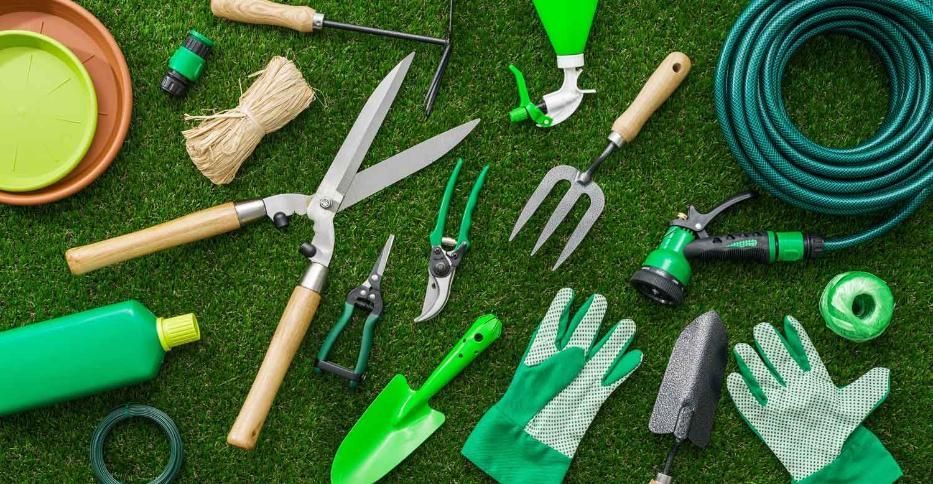 A Bunch of Gardening Tools Are Laying on the Grass — Hothams In Bathurst, NSW