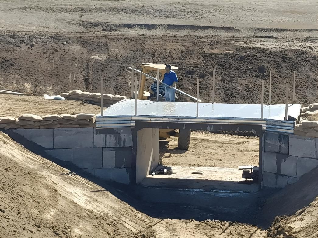 A Man is Standing on a Bridge Over a Body of Water — Hothams In Bathurst, NSW