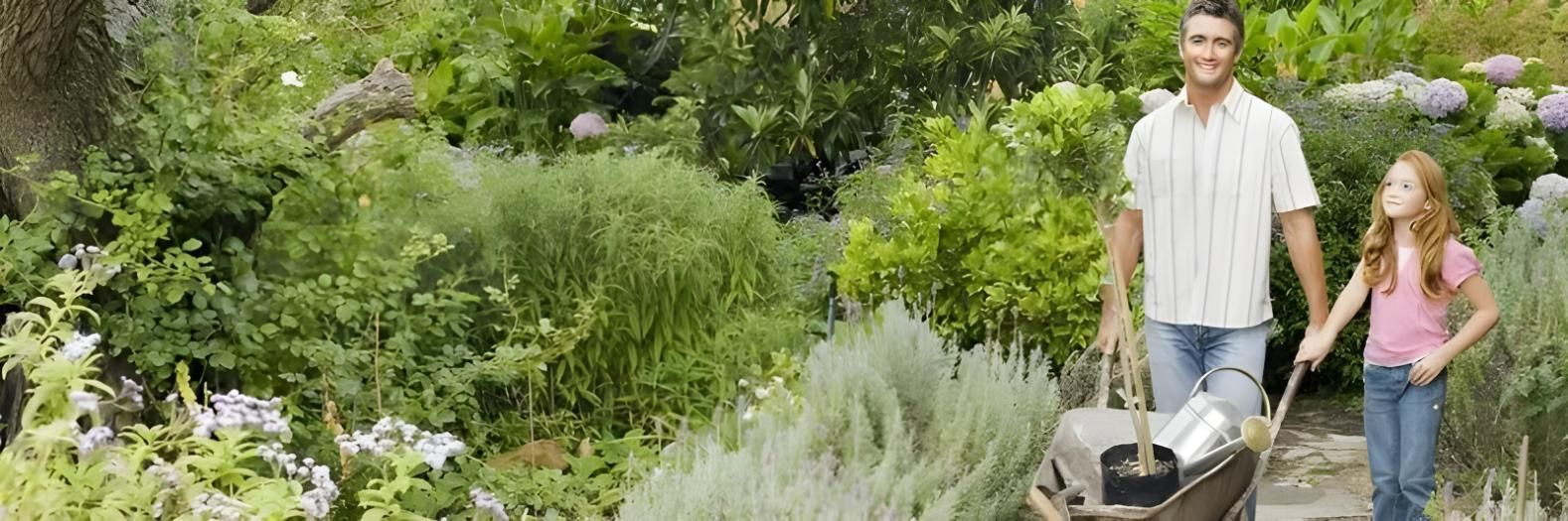 A Man and a Girl Are Pushing a Wheelbarrow in a Garden — Hothams In Bathurst, NSW