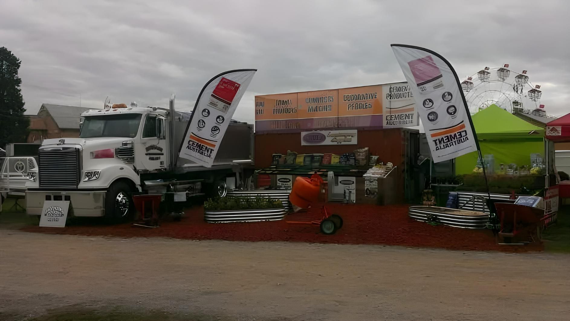 A White Truck is Parked in Front of a Building With a Sign That Says a on It — Hothams In Bathurst, NSW