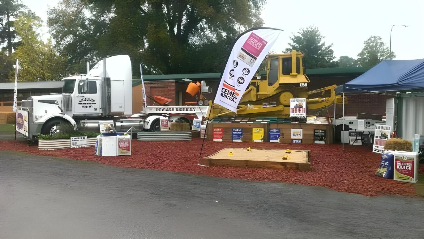 A Truck is Parked in Front of a Booth With a Bulldozer on Top of It — Hothams In Bathurst, NSW