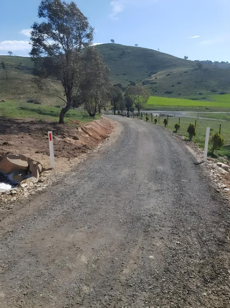 A Dirt Road Going Through a Field With Trees on Both Sides — Hothams In Bathurst, NSW