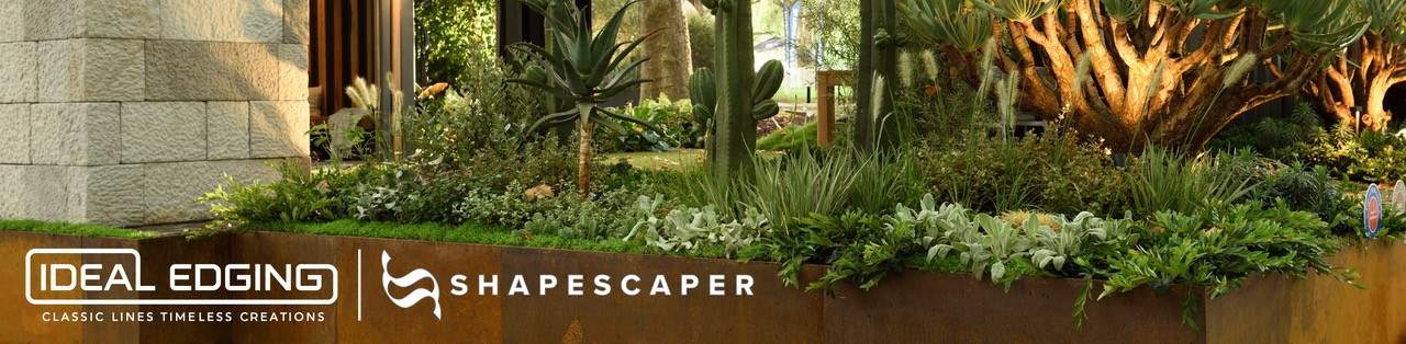 Lush green landscaping in a long, rust-colored planter — Hothams In Bathurst, NSW