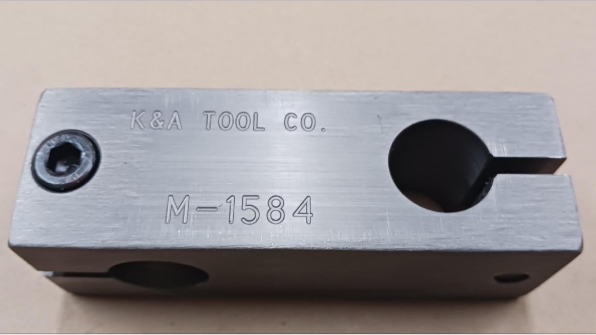 A close up of a copper connector on a wire.