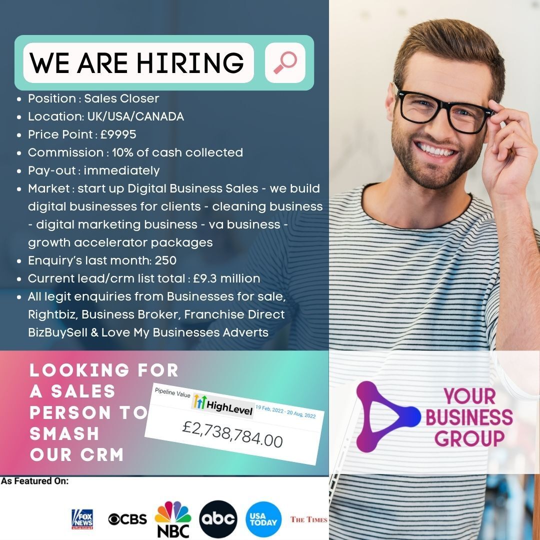 A man wearing glasses is smiling and looking for a sales person to smash our crm