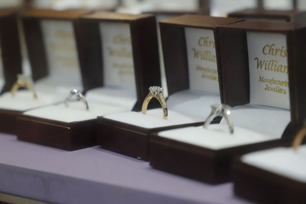 A Row of Individual Engagement Rings in Open Brown Boxes — Chris Williams Retail & Manufacturing Jewellers in Wanguri, NT