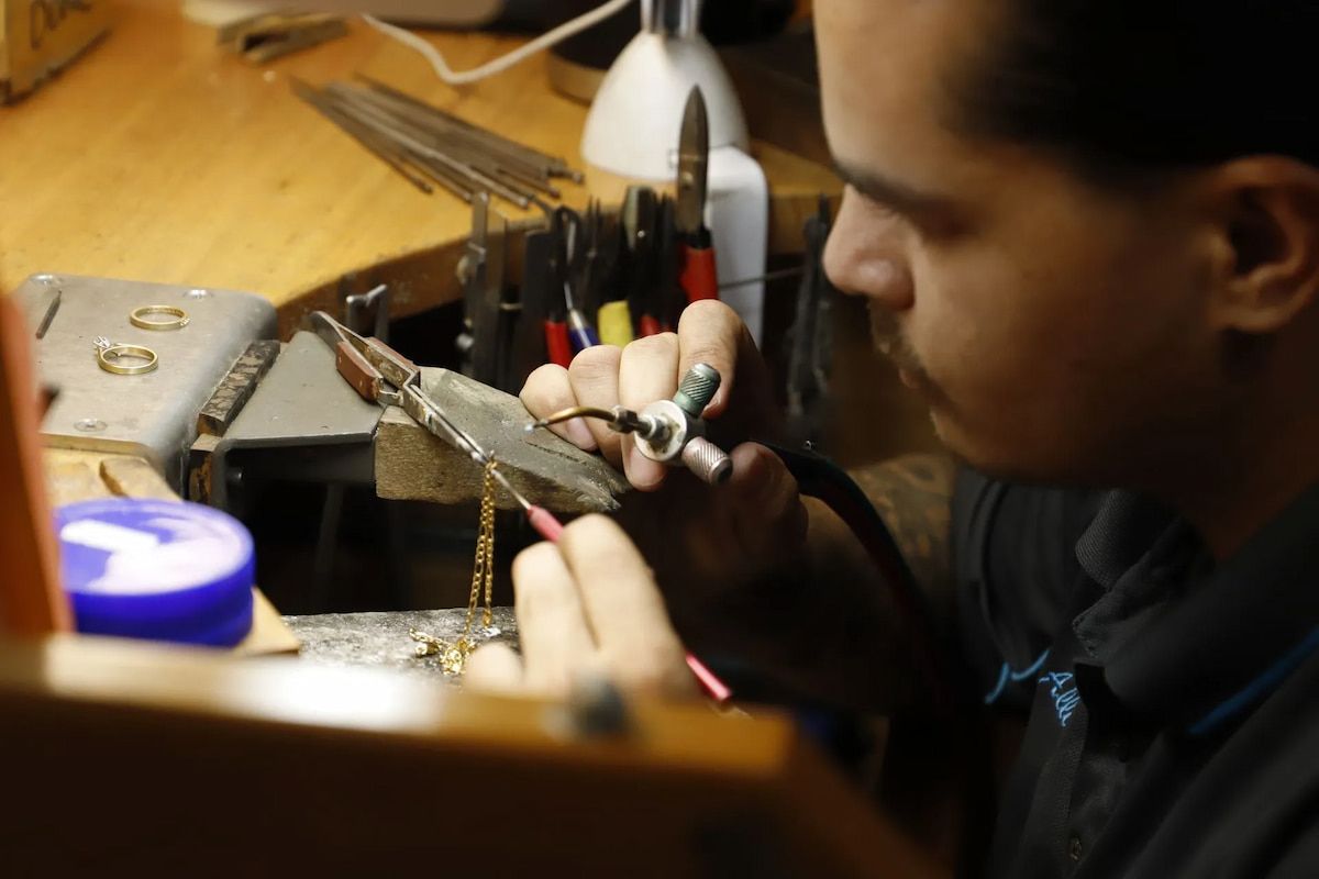 Jeweler Soldering a Chain at a Workbench — Chris Williams Retail & Manufacturing Jewellers in Wanguri, NT