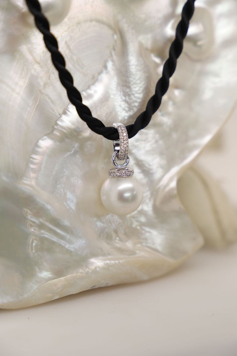 A White Pearl Pendant With a Diamond-encrusted Bale — Chris Williams Retail & Manufacturing Jewellers in Wanguri, NT