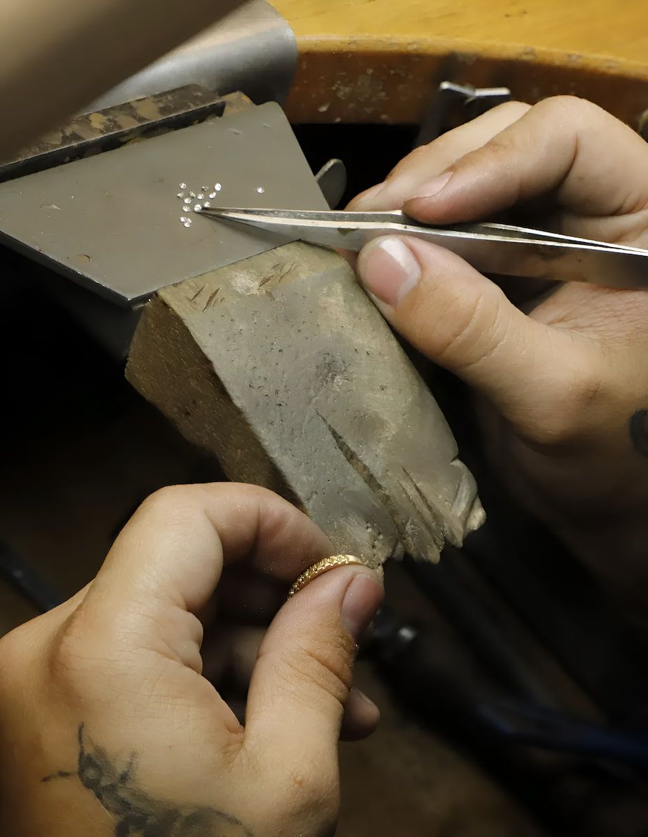 Jeweler Using Tweezers Peridot Earrings in a Jewelry Box — Chris Williams Retail & Manufacturing Jewellers in Wanguri, NT