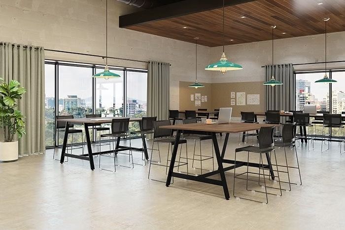 A large room with tables and chairs in it.