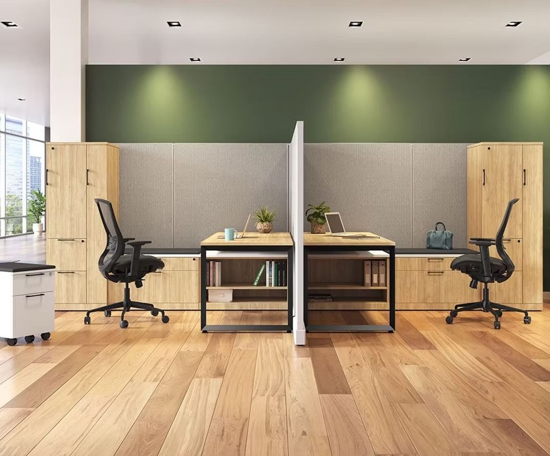 A wooden floored office with two desks and two chairs.