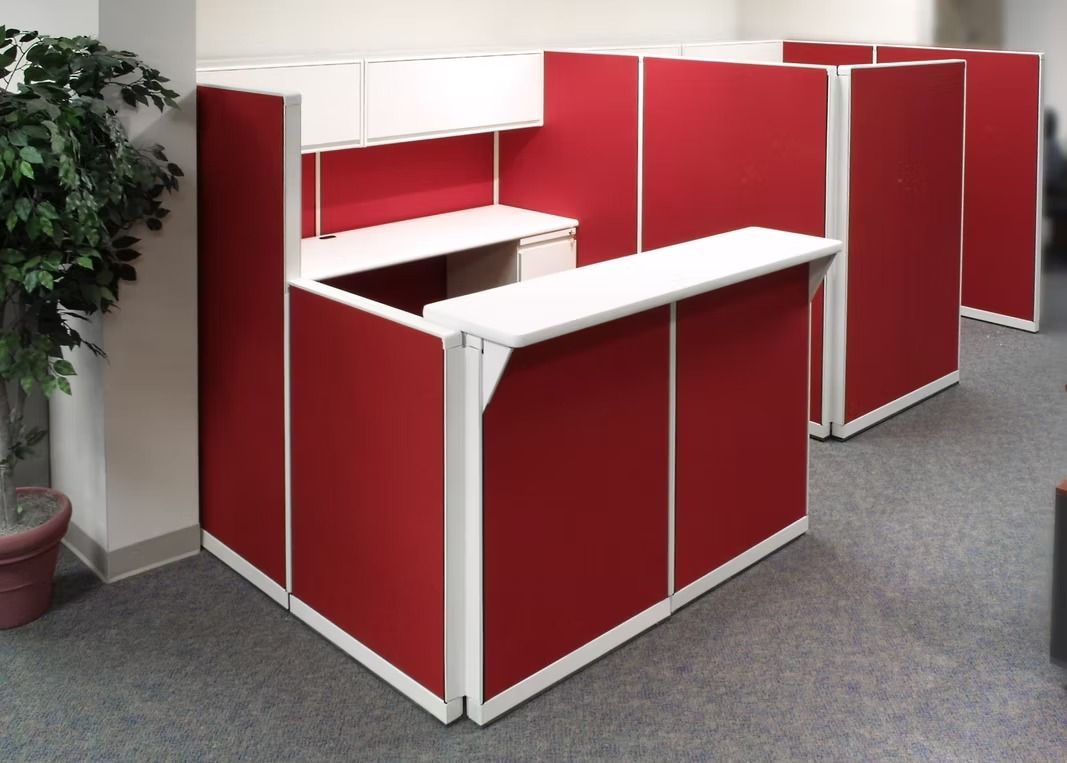 A row of red and white cubicles in an office