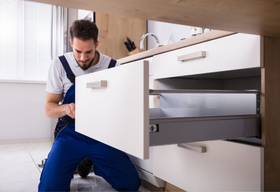 handyman installing drawer
