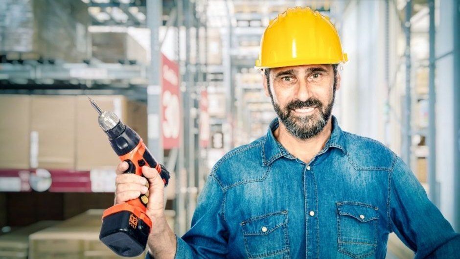 handyman holding electric drill