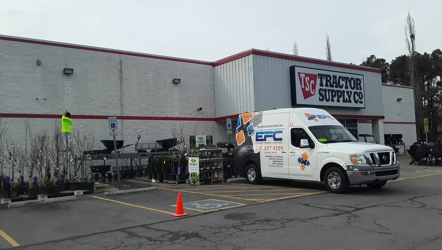 Tractor Supply Co. store exterior with a white service van in front of the entrance.