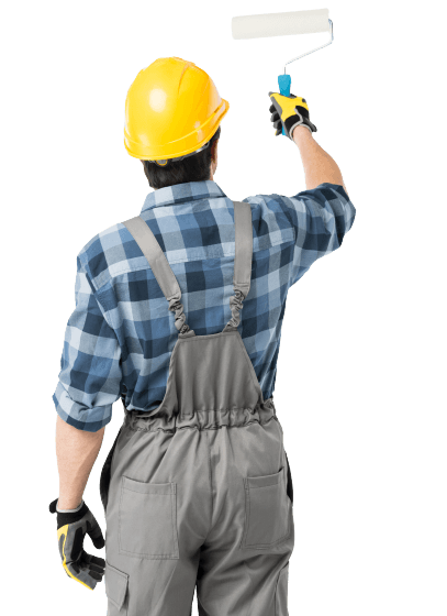 Painter in a yellow hard hat, overalls, and plaid shirt using a paint roller on a white surface.