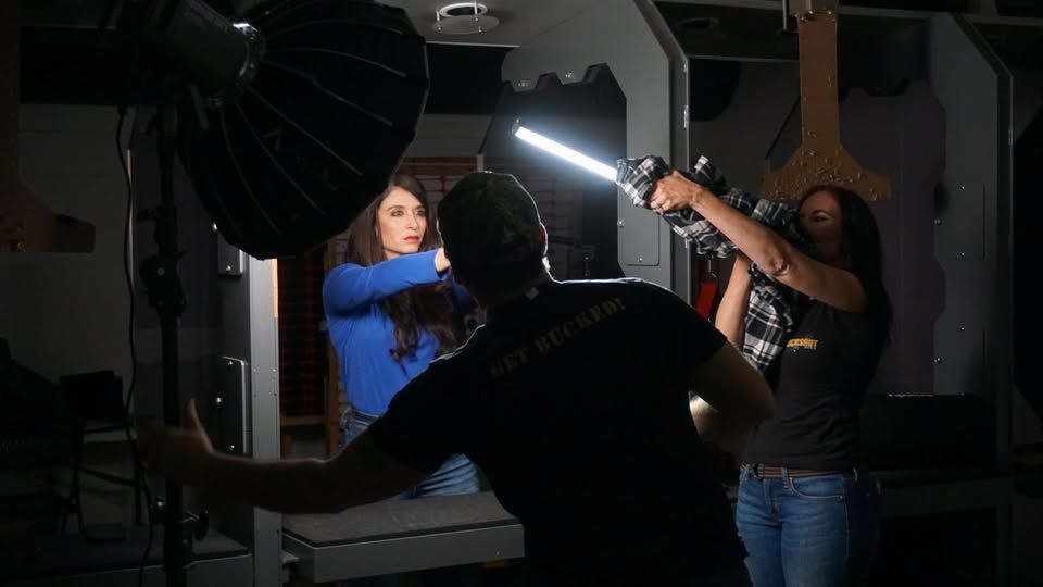Amanda Hardin in a studio range setup under professional lighting during a photo shoot.