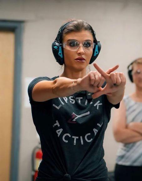 Amanda Hardin leading firearm safety class at Lipstick Tactical with strong command presence.