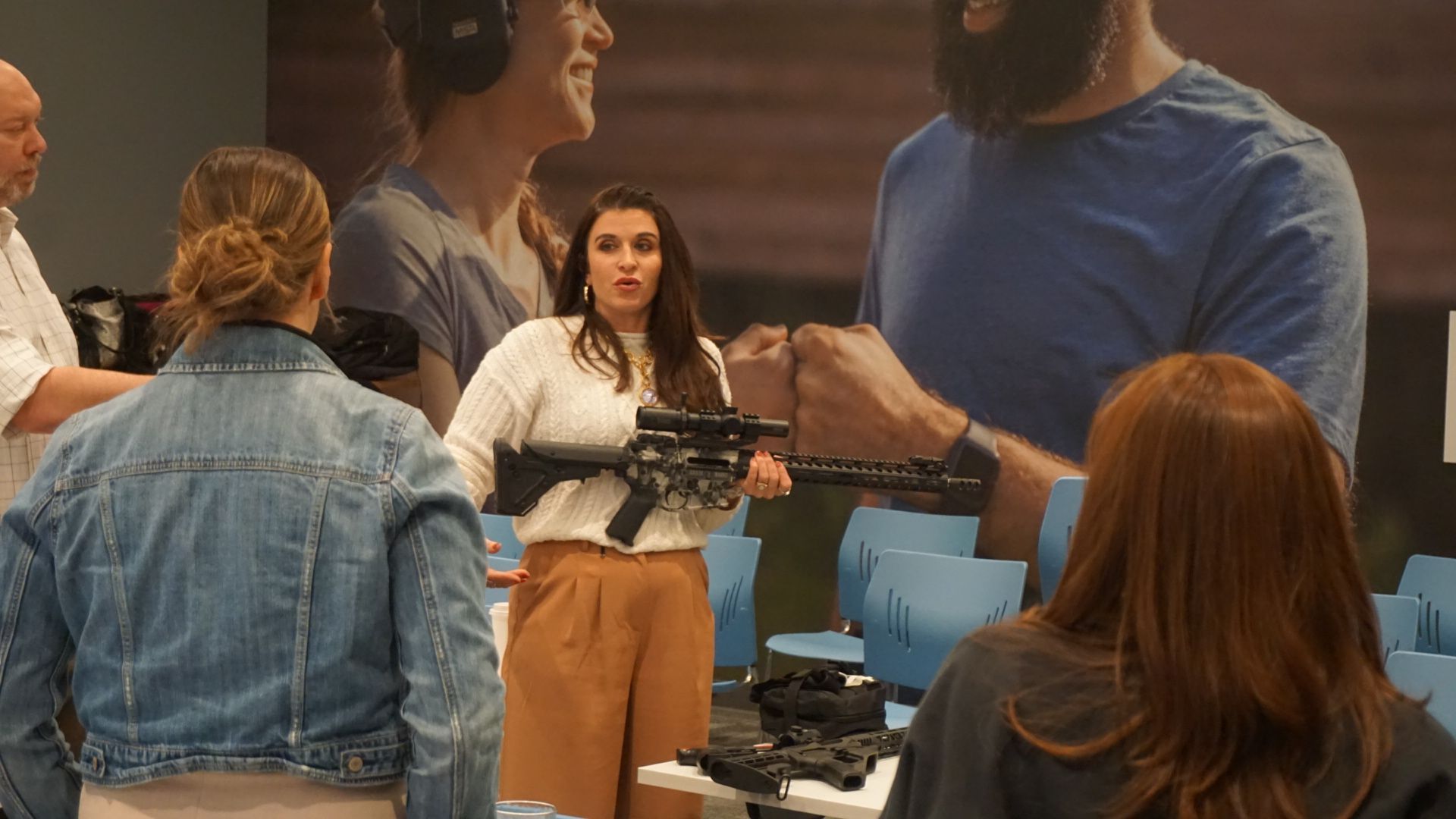 Amanda Hardin demonstrating rifle handling during group training for Avenir Consulting clients.