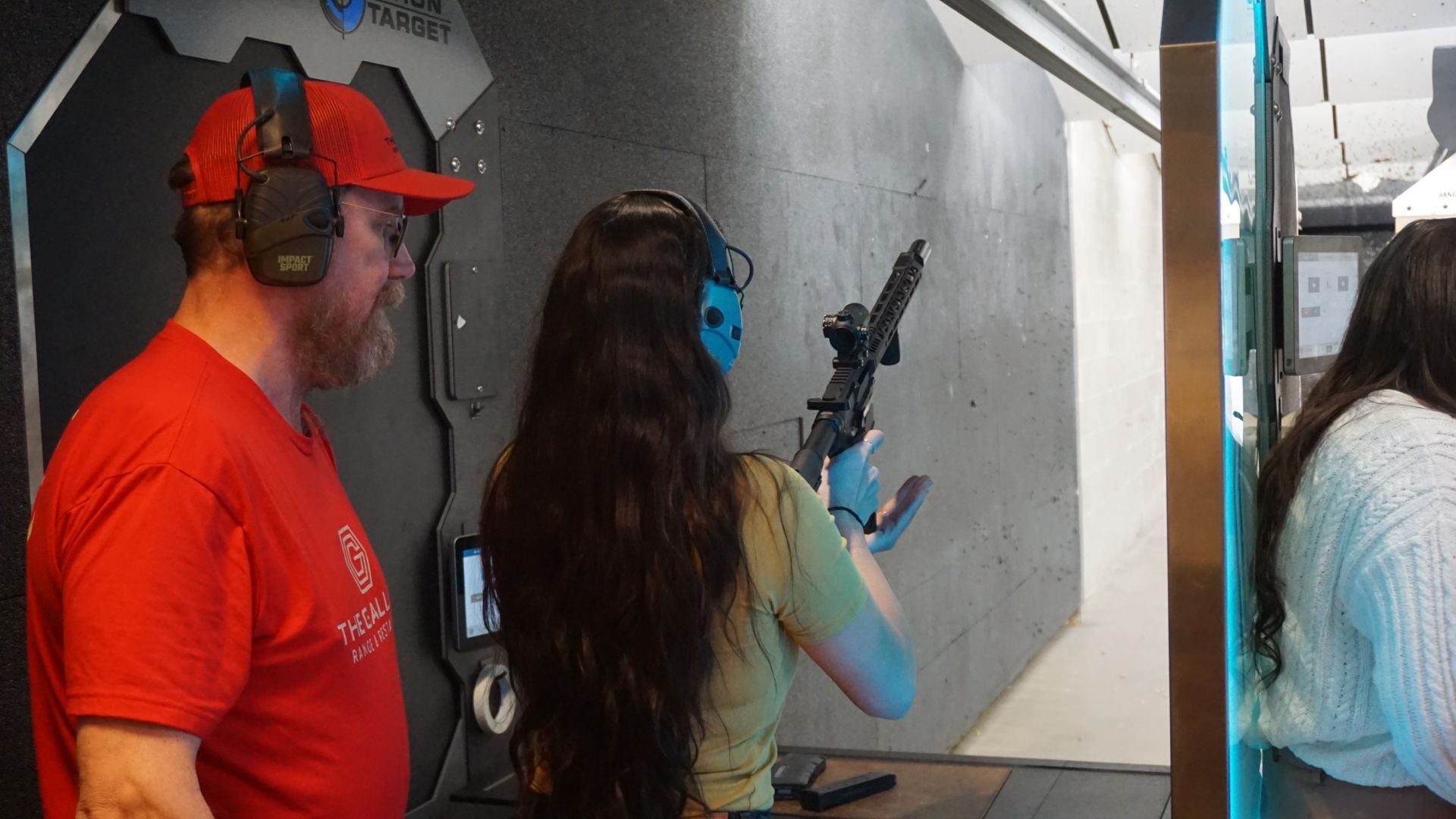 Avenir Consulting firearms coach guiding student through safe range handling techniques.