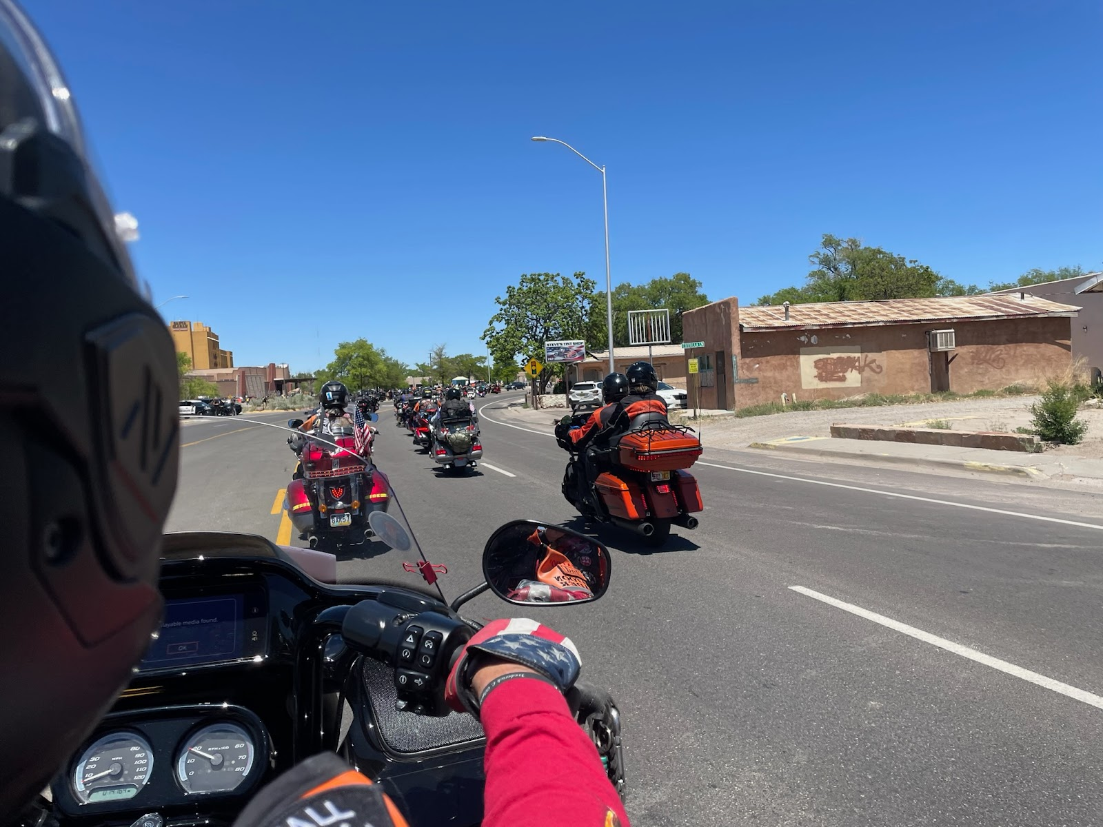A person is riding a motorcycle down a street