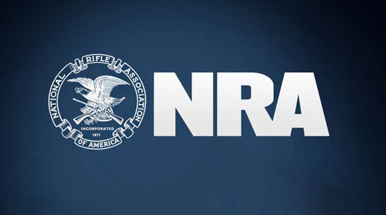 NRA logo featuring a bald eagle and crossed rifles with bold NRA letters on navy background.