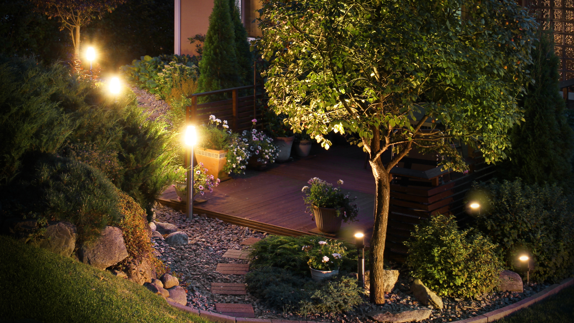 A man is cleaning an air conditioner in a living room.