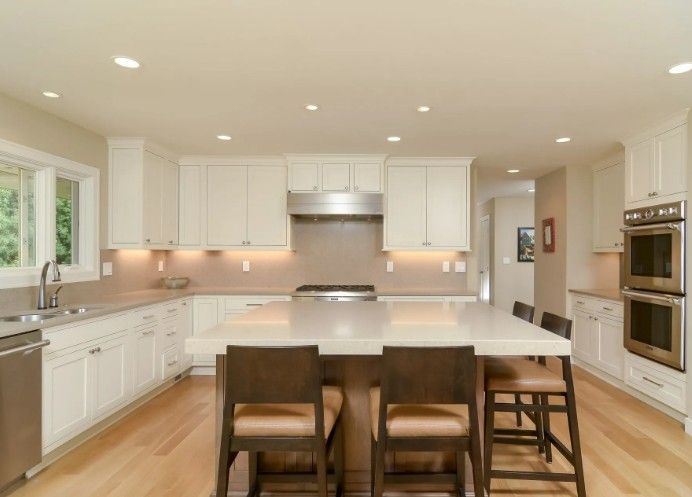 new modern kitchen with quartz countertops and white cabinets